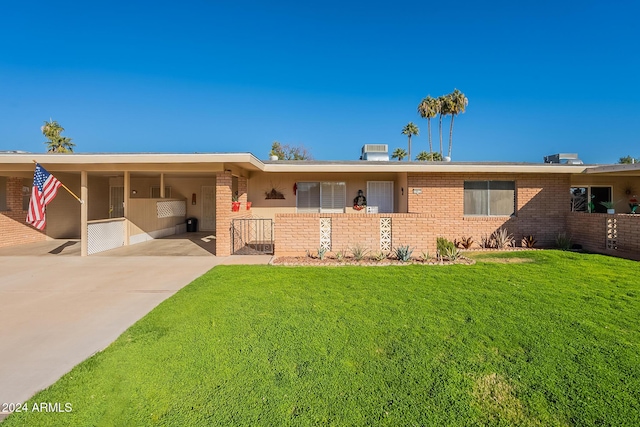 10412 W Audrey Dr, Sun City, AZ 85351 - view of front of property featuring a front yard and a carport