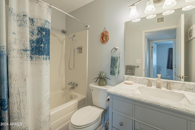 full bathroom with vanity, toilet, and shower / tub combo