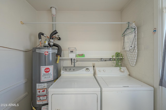 washroom featuring separate washer and dryer and gas water heater