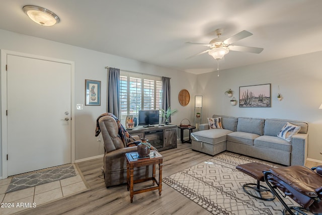 living room featuring ceiling fan and light hardwood / wood-style floors