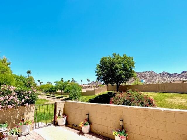 10229 N 12th Ct Unit 1, Phoenix, AZ 85020 - view of patio / terrace with a mountain view and a gate
