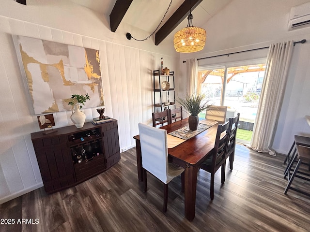251 W 8th St, Ajo, AZ 85321 - dining room with a wall unit AC, dark wood-style flooring, and a chandelier