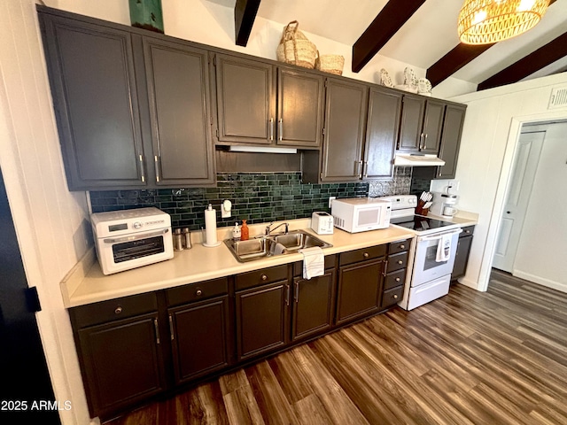 251 W 8th St, Ajo, AZ 85321 - kitchen with white appliances, a sink, tasteful backsplash, dark wood-type flooring, and under cabinet range hood