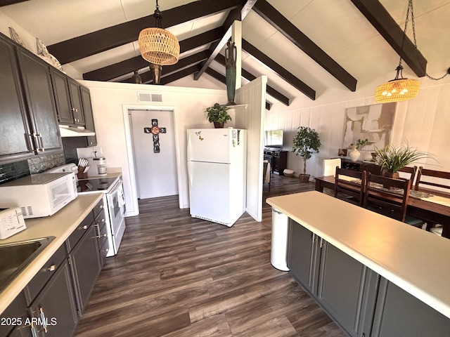 251 W 8th St, Ajo, AZ 85321 - kitchen with white appliances, under cabinet range hood, dark wood-style flooring, hanging light fixtures, and a sink
