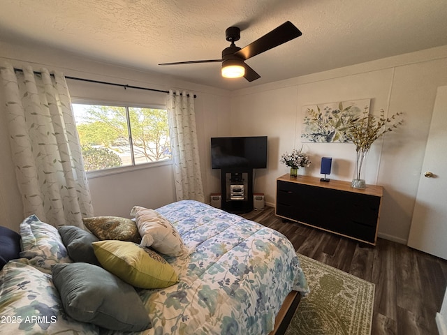 251 W 8th St, Ajo, AZ 85321 - bedroom featuring a textured ceiling, wood finished floors, and ceiling fan