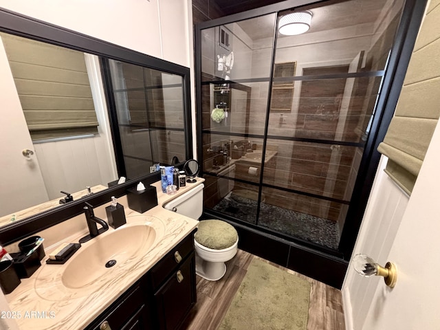 251 W 8th St, Ajo, AZ 85321 - bathroom featuring toilet, wood finished floors, vanity, and a shower stall