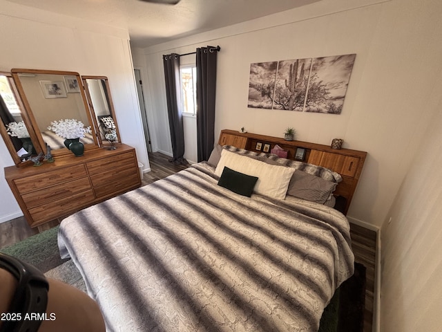 251 W 8th St, Ajo, AZ 85321 - bedroom featuring dark wood-style flooring, multiple windows, and baseboards