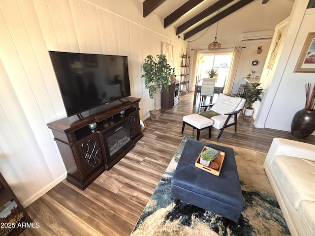 251 W 8th St, Ajo, AZ 85321 - living room with wood finished floors and an AC wall unit