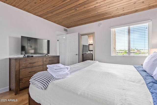 bedroom with light wood-style flooring, wooden ceiling, baseboards, and visible vents