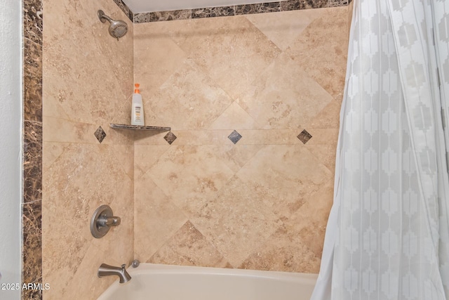 bathroom with shower / bath combo with shower curtain