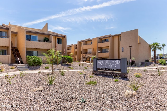 view of property's community featuring stairs