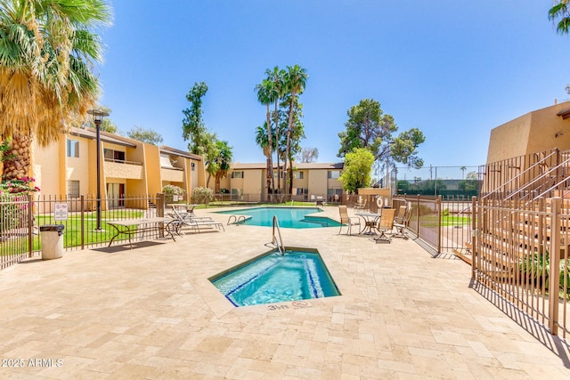 pool featuring a patio and fence