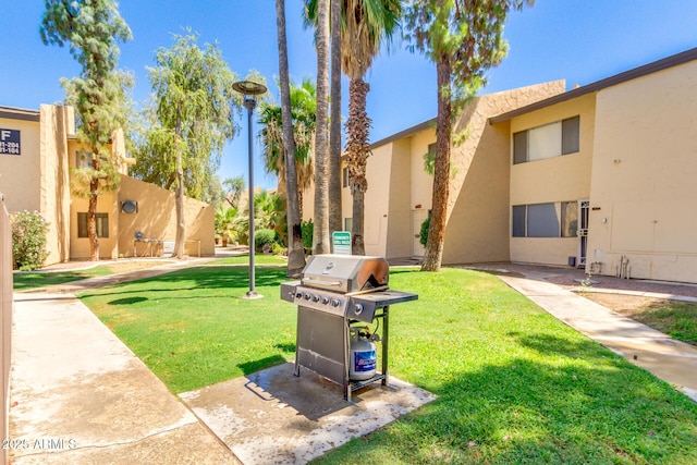 view of property's community with a lawn