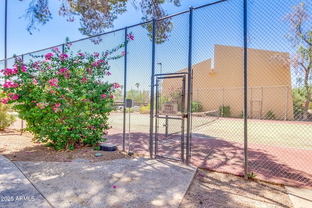 exterior space with fence and a gate