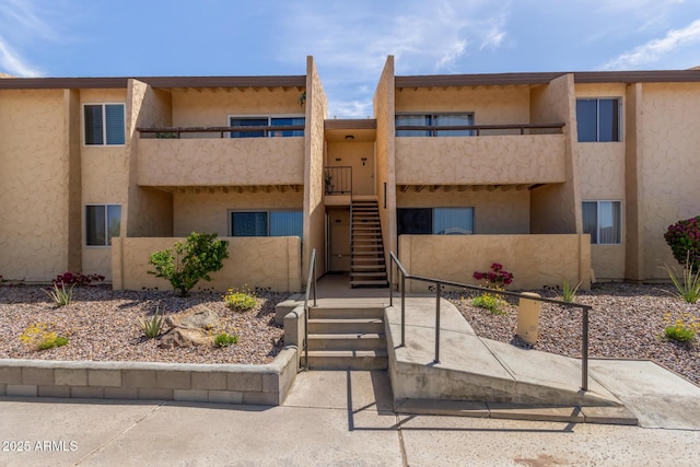 view of property featuring stairway