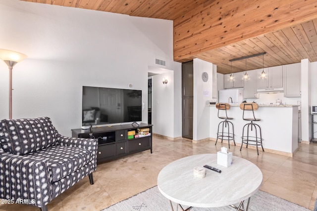 living room with visible vents, wooden ceiling, light tile patterned floors, and lofted ceiling