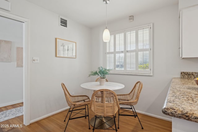 dining room with light hardwood / wood-style floors