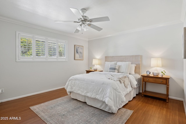 bedroom featuring wood-type flooring, ceiling fan, and crown molding