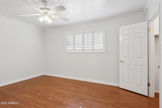 spare room featuring crown molding, ceiling fan, and hardwood / wood-style floors