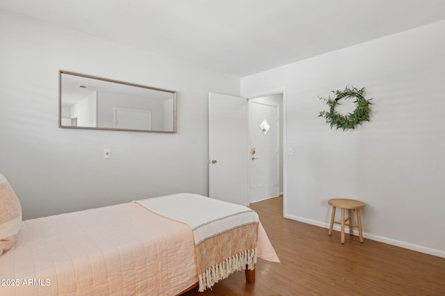 bedroom featuring hardwood / wood-style flooring