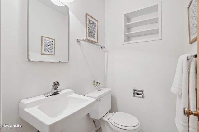 bathroom with toilet and sink