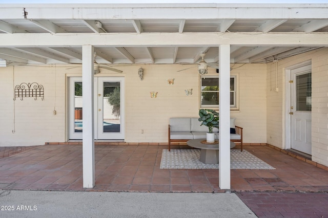 entrance to property featuring a patio area