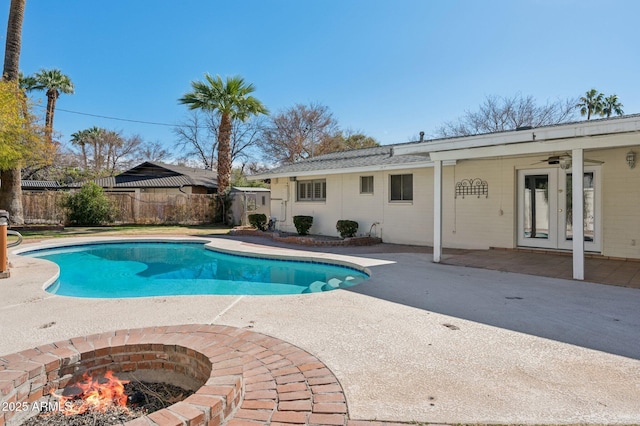 view of pool featuring a patio and ceiling fan