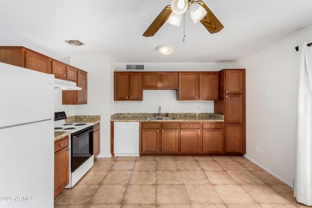 kitchen with tasteful backsplash, ceiling fan, sink, and white appliances