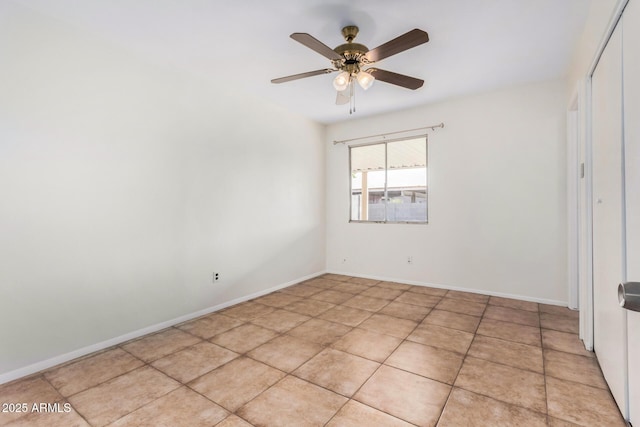 unfurnished room featuring light tile patterned floors and ceiling fan