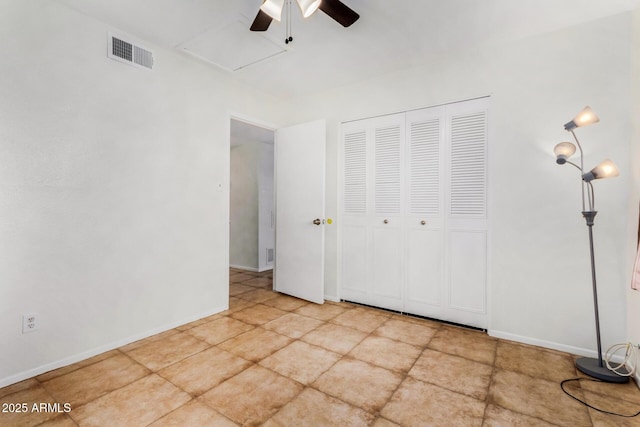 unfurnished bedroom with a closet and ceiling fan