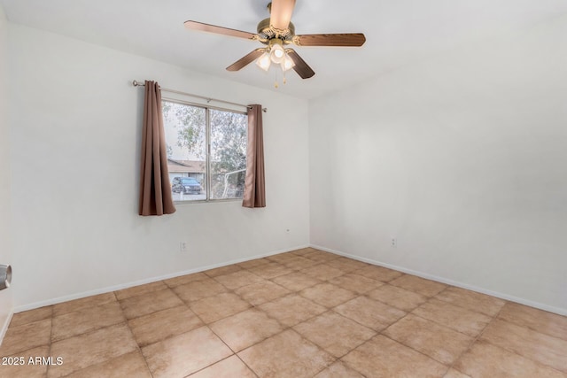 spare room with ceiling fan