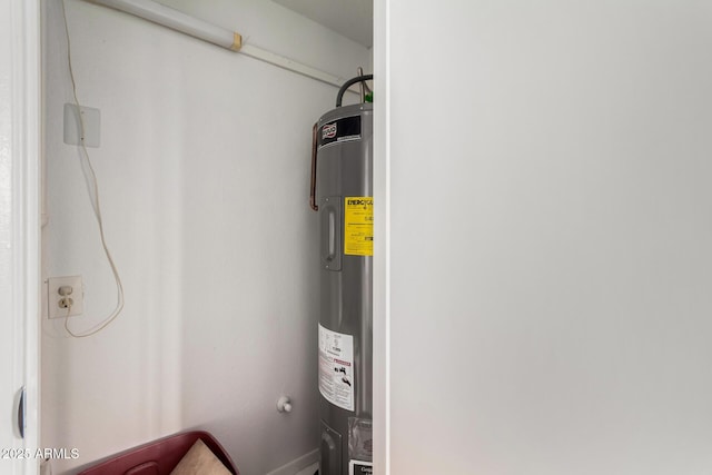 utility room featuring electric water heater