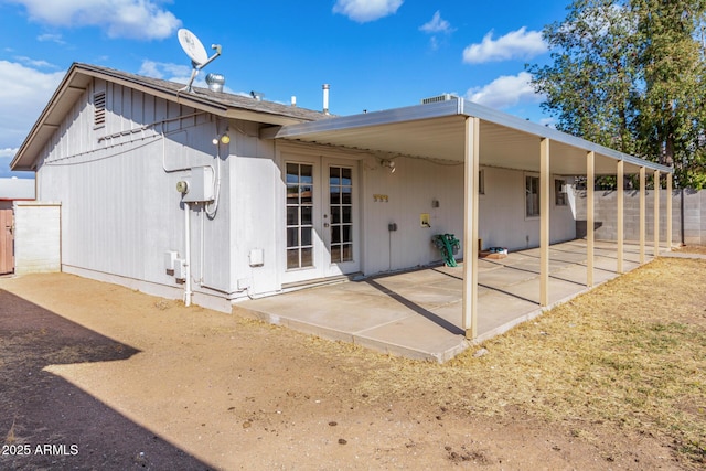 back of property featuring french doors and a patio