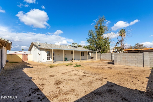 back of house with a patio area