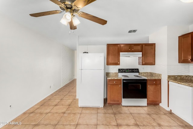 kitchen featuring light tile patterned floors, ceiling fan, range with electric cooktop, light stone counters, and white fridge