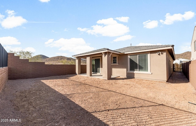 back of property featuring a patio area