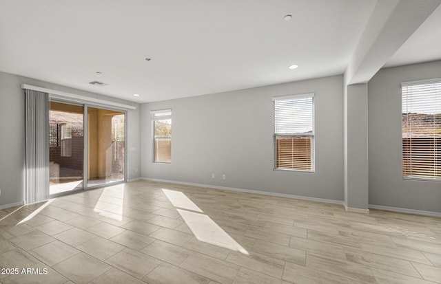 spare room featuring plenty of natural light