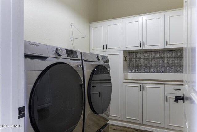 1123 E Shepherds Way, Casa Grande, AZ 85122 - laundry room featuring washer and clothes dryer, cabinet space, and wood finished floors