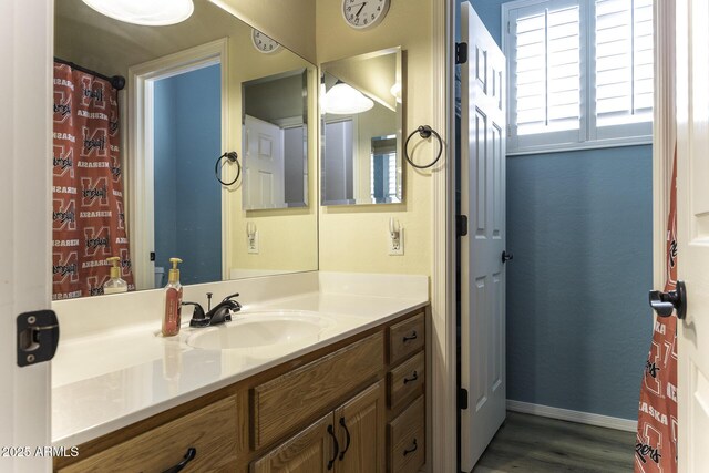 1123 E Shepherds Way, Casa Grande, AZ 85122 - bathroom featuring wood finished floors, vanity, and baseboards