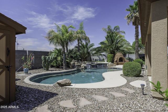 1123 E Shepherds Way, Casa Grande, AZ 85122 - view of pool featuring a fenced backyard and a pool with connected hot tub
