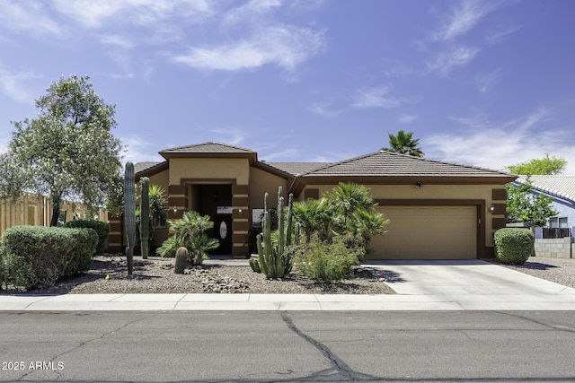 1123 E Shepherds Way, Casa Grande, AZ 85122 - view of front of home with an attached garage, stucco siding, concrete driveway, and a tile roof