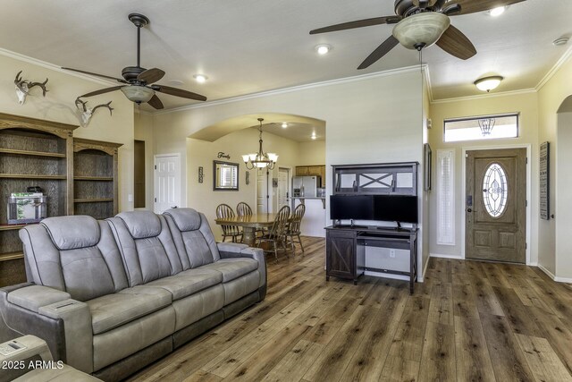 1123 E Shepherds Way, Casa Grande, AZ 85122 - living area with a ceiling fan, arched walkways, crown molding, a chandelier, and hardwood / wood-style flooring