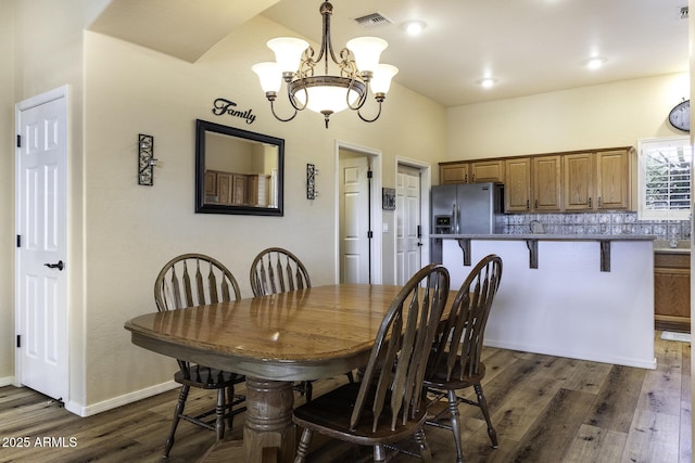1123 E Shepherds Way, Casa Grande, AZ 85122 - dining space featuring dark wood-style floors, a chandelier, and baseboards