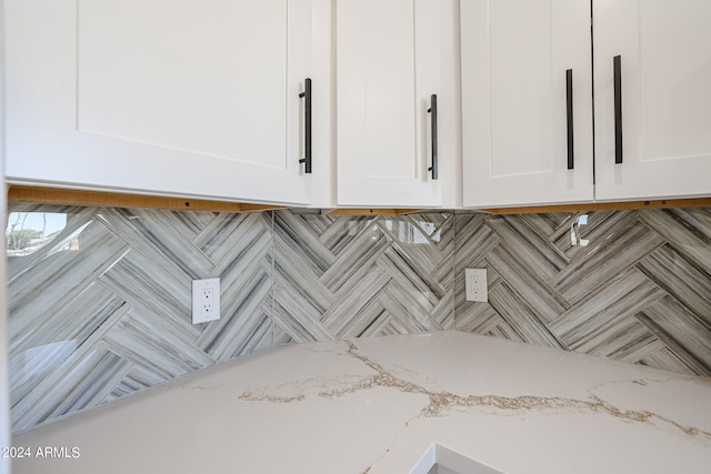 room details with light stone counters and white cabinets