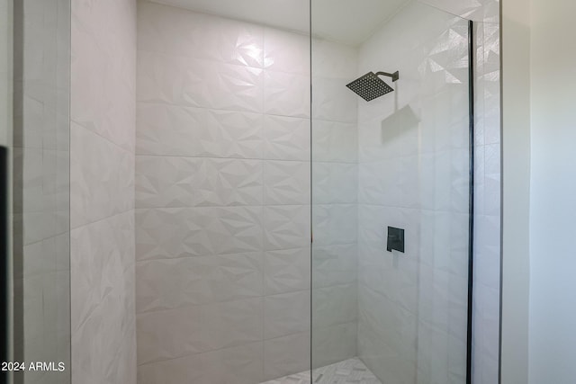 bathroom with tiled shower