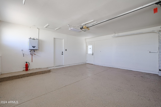 garage featuring a garage door opener and water heater