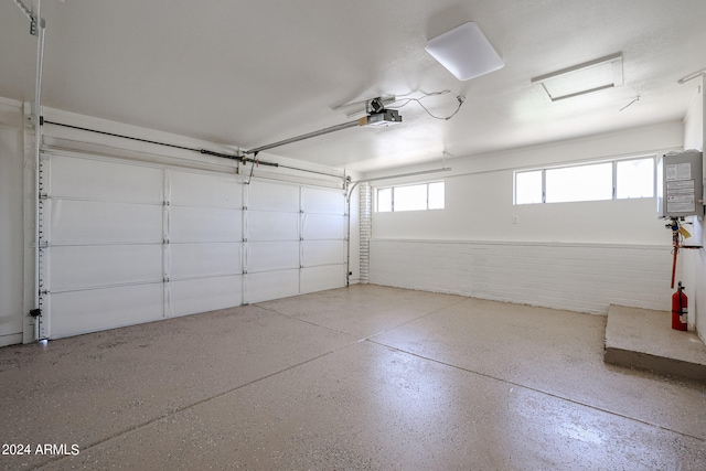 garage with a garage door opener and water heater