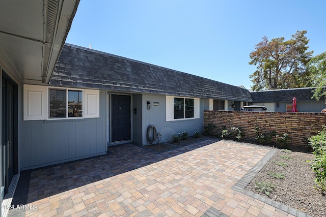 view of patio featuring fence