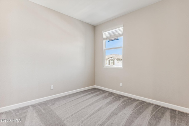 5844 E Covey Ln, Phoenix, AZ 85054 - spare room featuring carpet floors and baseboards