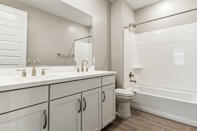5844 E Covey Ln, Phoenix, AZ 85054 - full bath with toilet, wood finish floors, shower / bathtub combination, and double vanity